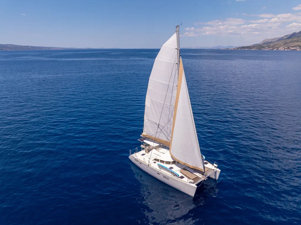 Sailing catamaran on the Adriatic with full sails